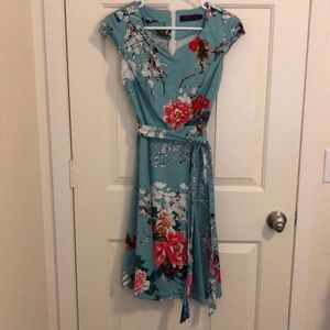 Dress Tells 1950 style blue floral swing dress
